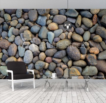 Bild på Natural colorful stone on the beach outdoor day light